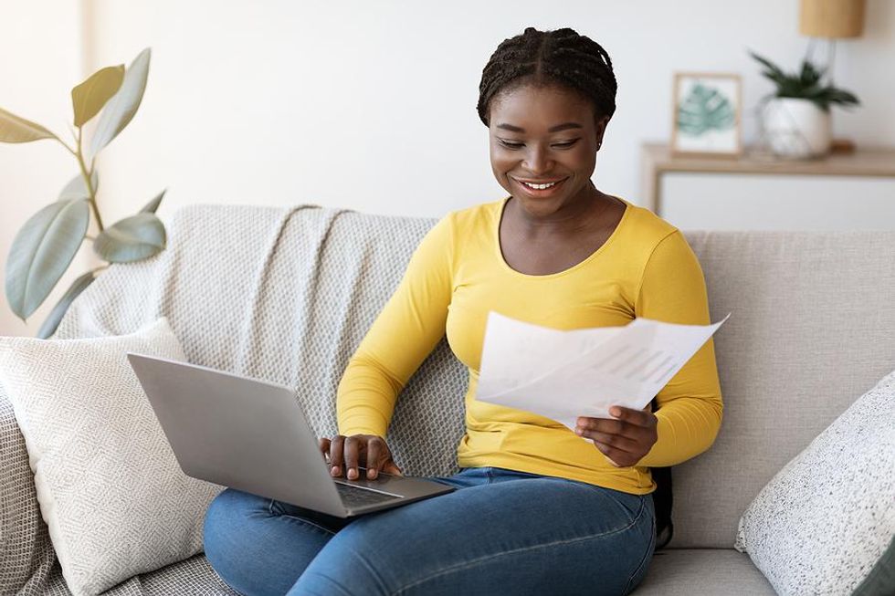 Woman on laptop works from home in her new career
