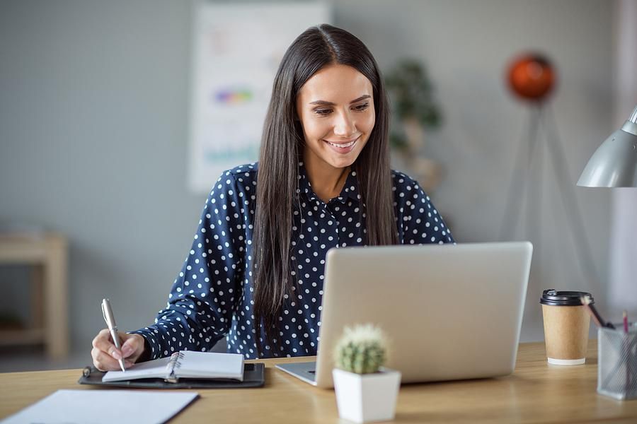 Woman on laptop works to customize her resume