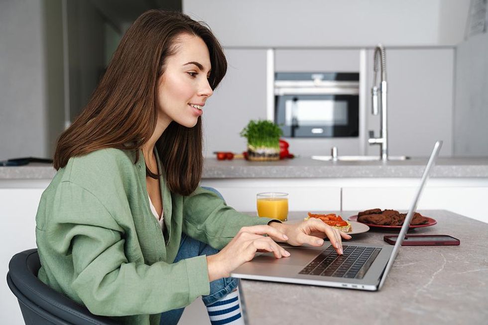 Woman on laptop writes a career change resume