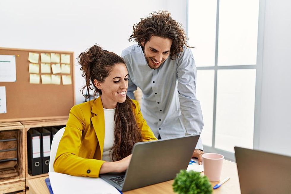 Woman on laptop writes a LinkedIn endorsement for a colleague