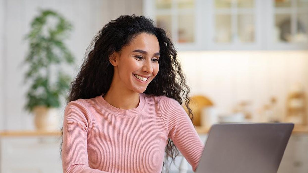 Woman on laptop writes a thank-you note after a job interview
