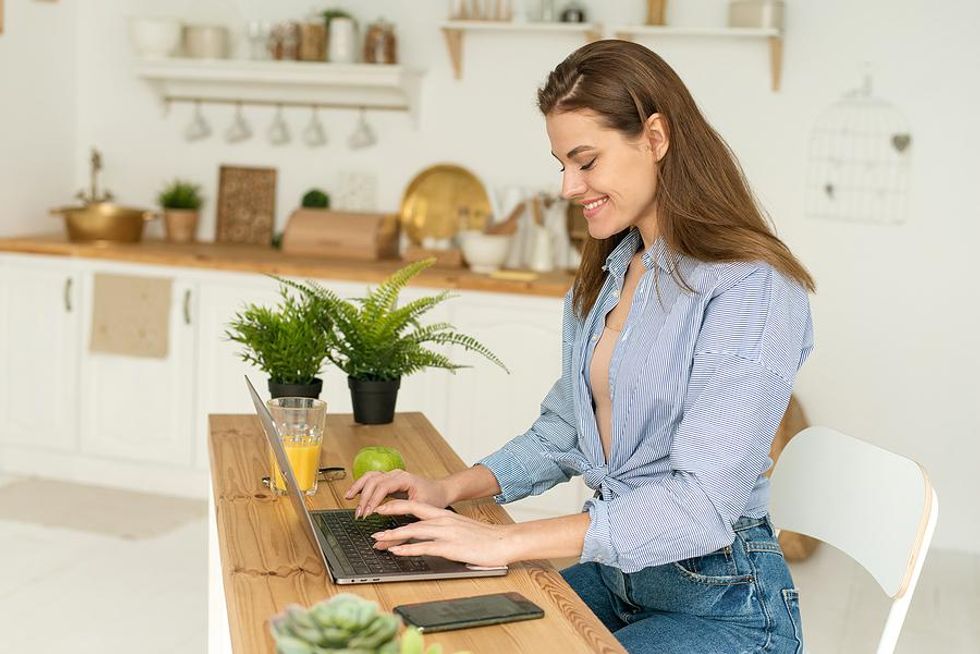 Woman on laptop writes an introduction email to someone in her network