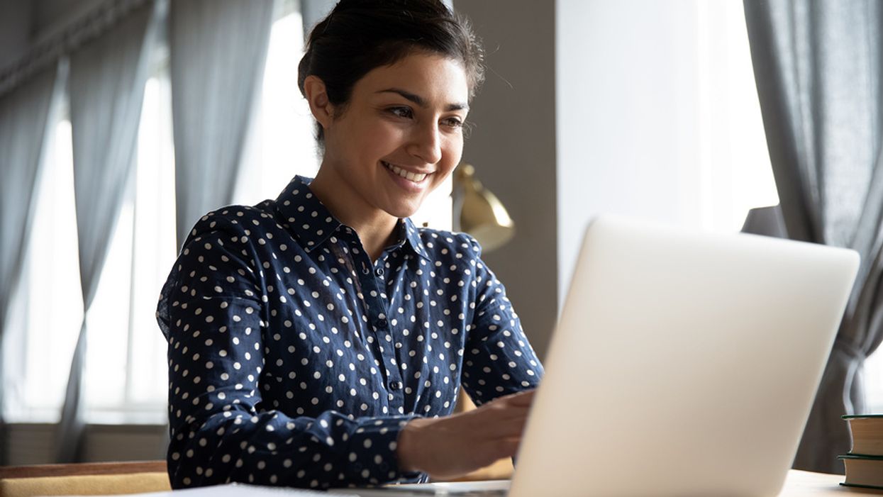 Woman on laptop writing her cover letter for a job posting