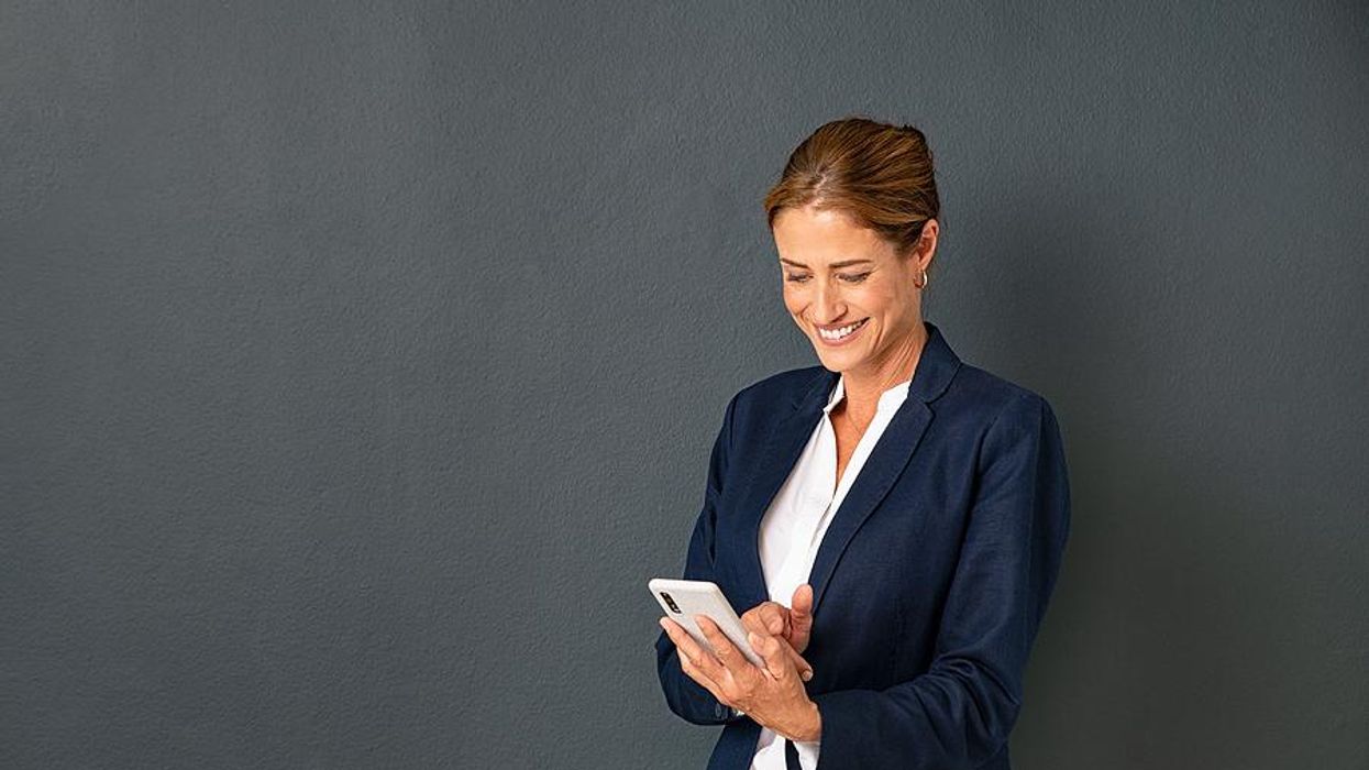 Woman on phone actively manages her career