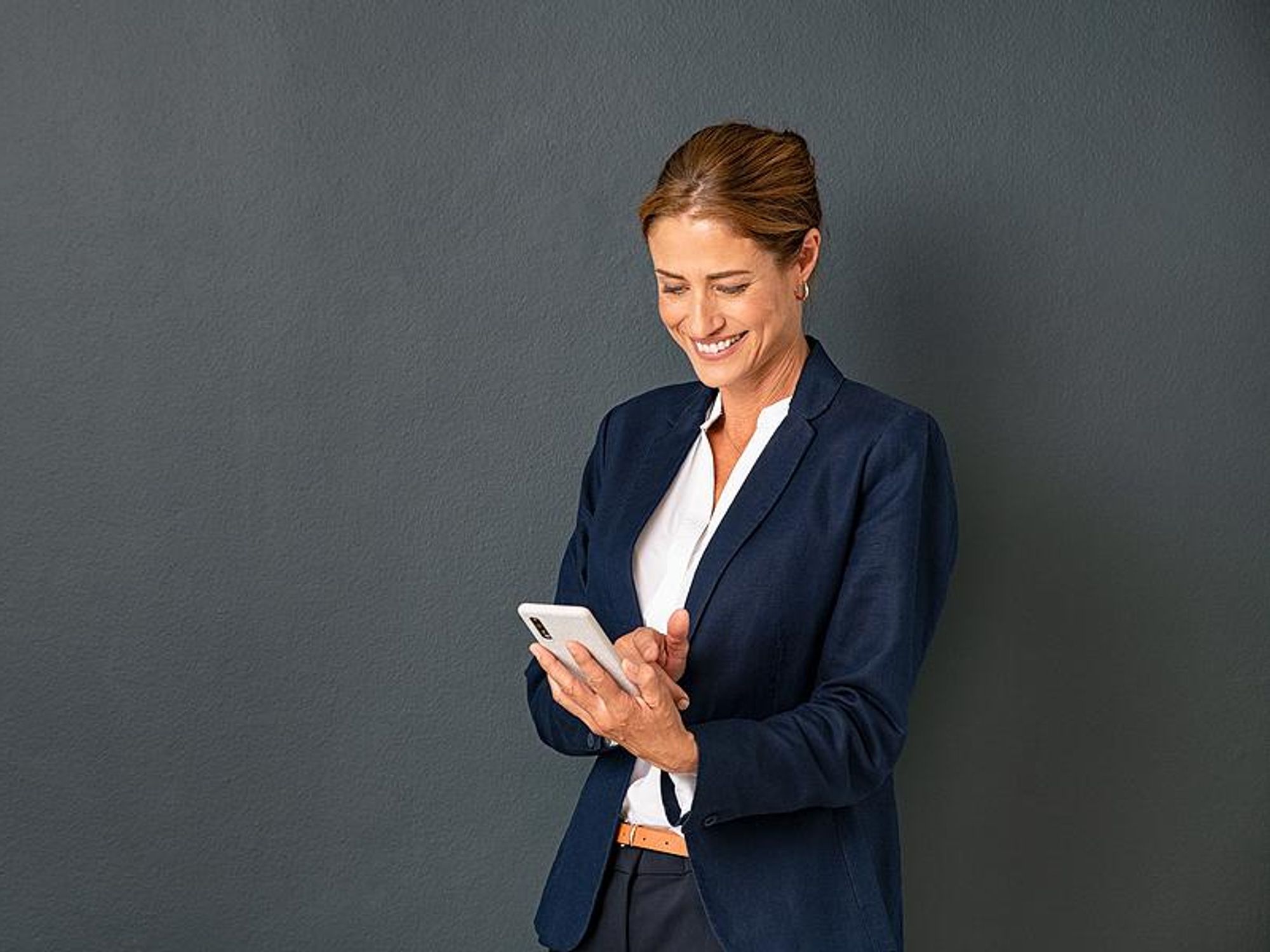 Woman on phone actively manages her career