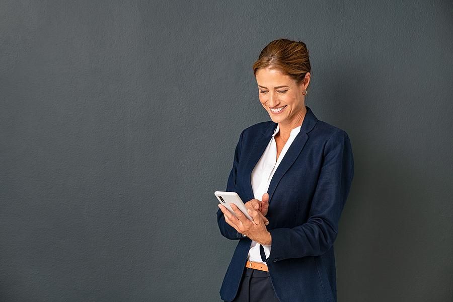 Woman on phone actively manages her career