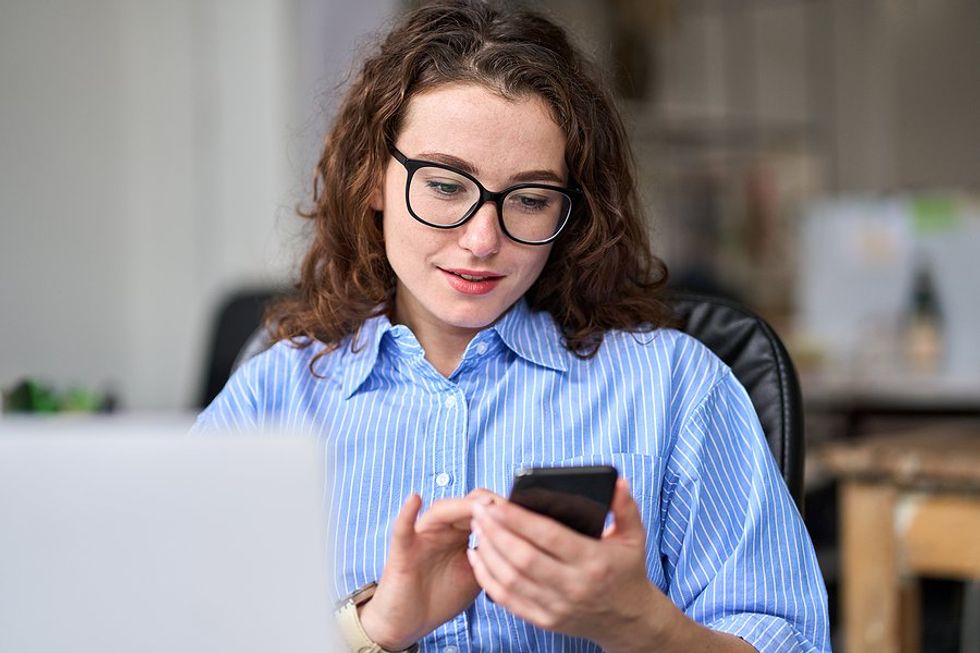 Woman on phone finds job search resources