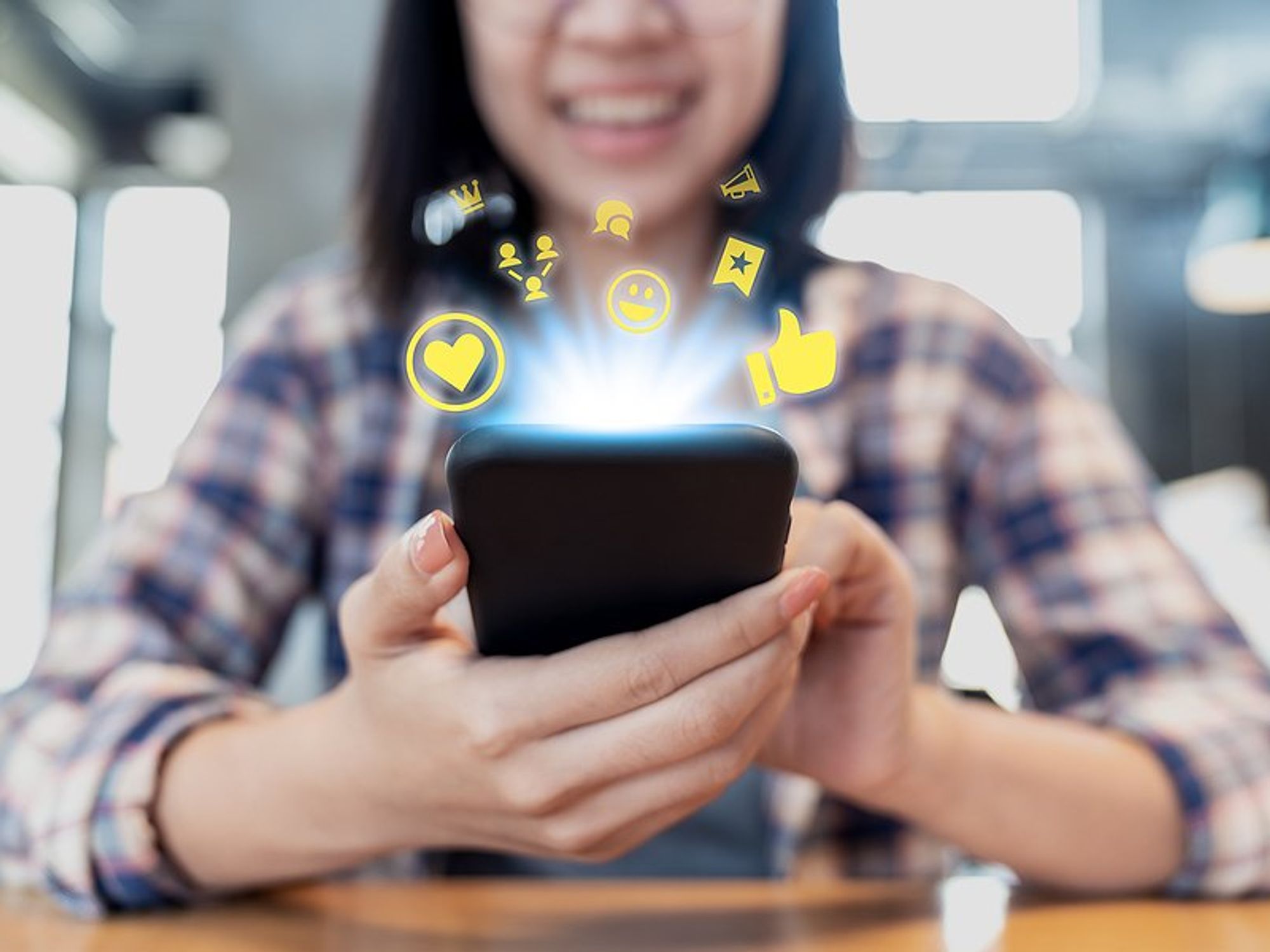 Woman on phone participates in and builds a community online