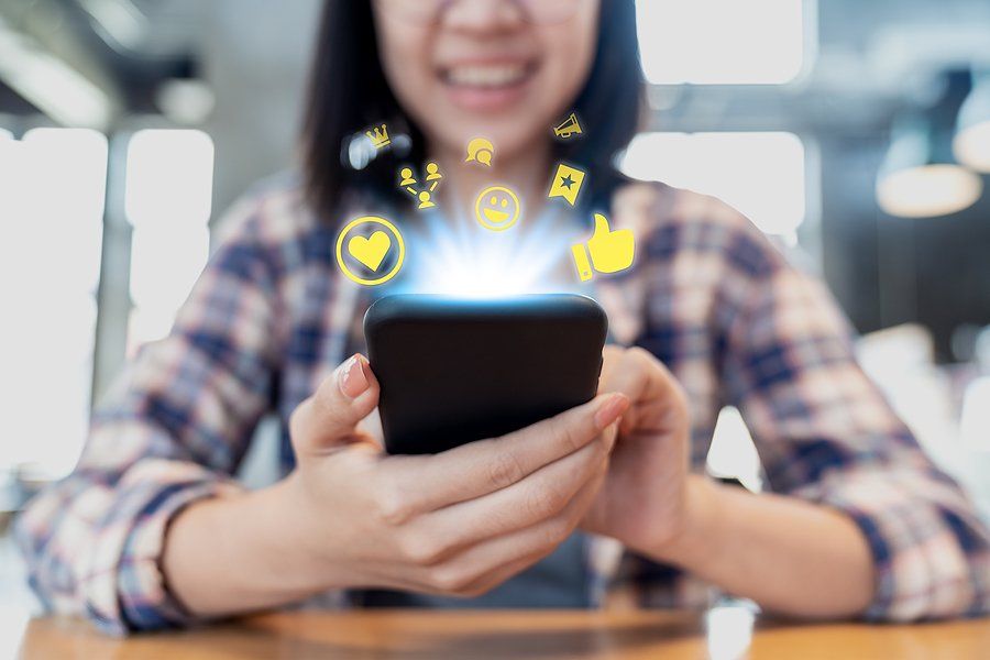 Woman on phone participates in and builds a community online