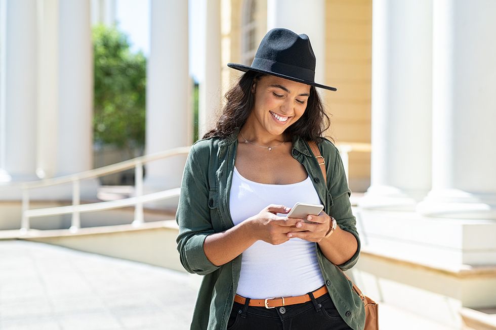 Woman on phone relaunches her career by using social media