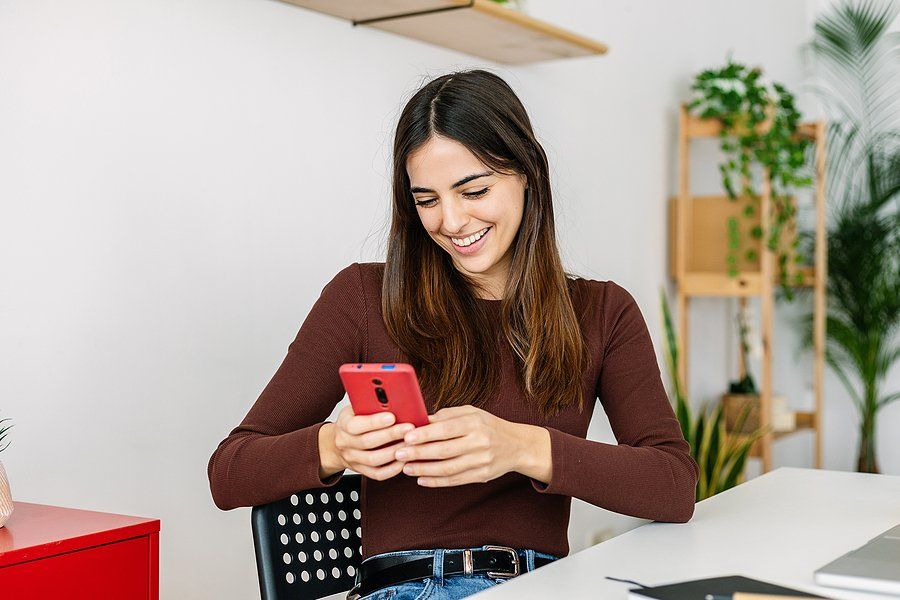 Woman on phone takes Work It Daily's free Career Decoder Quiz