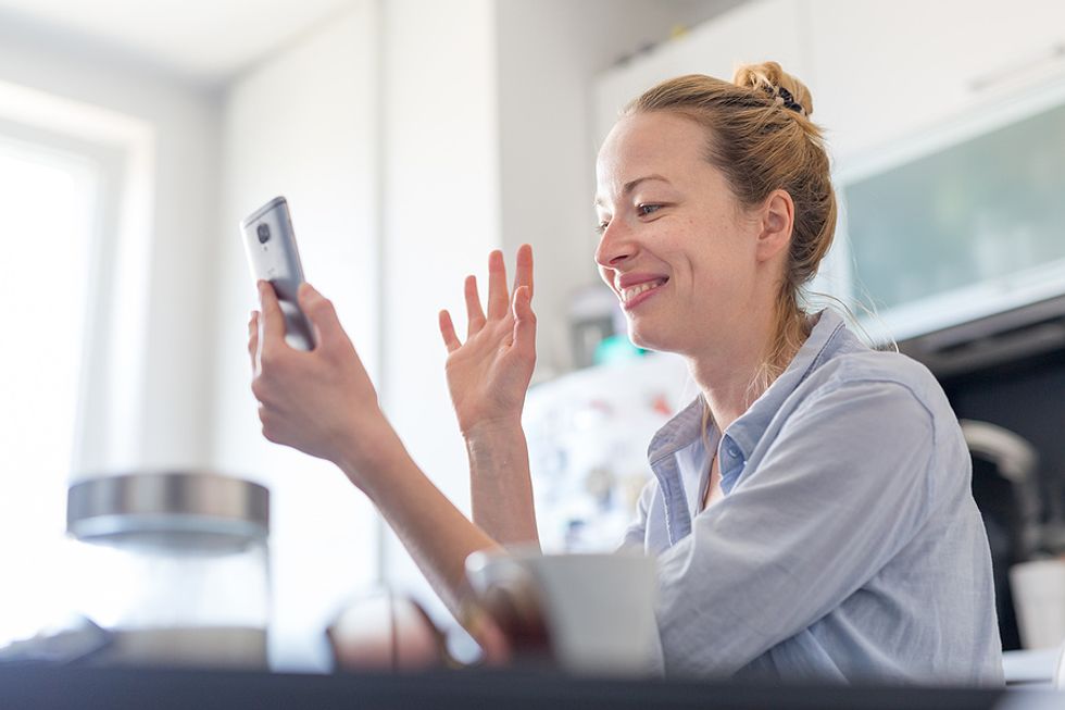 Woman on phone talks to her network while trying to return to the workforce