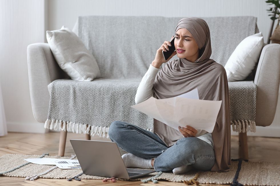Woman on the phone with her mortgage servicer