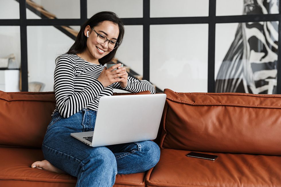 Woman optimizes her resume and LinkedIn profile while unemployed
