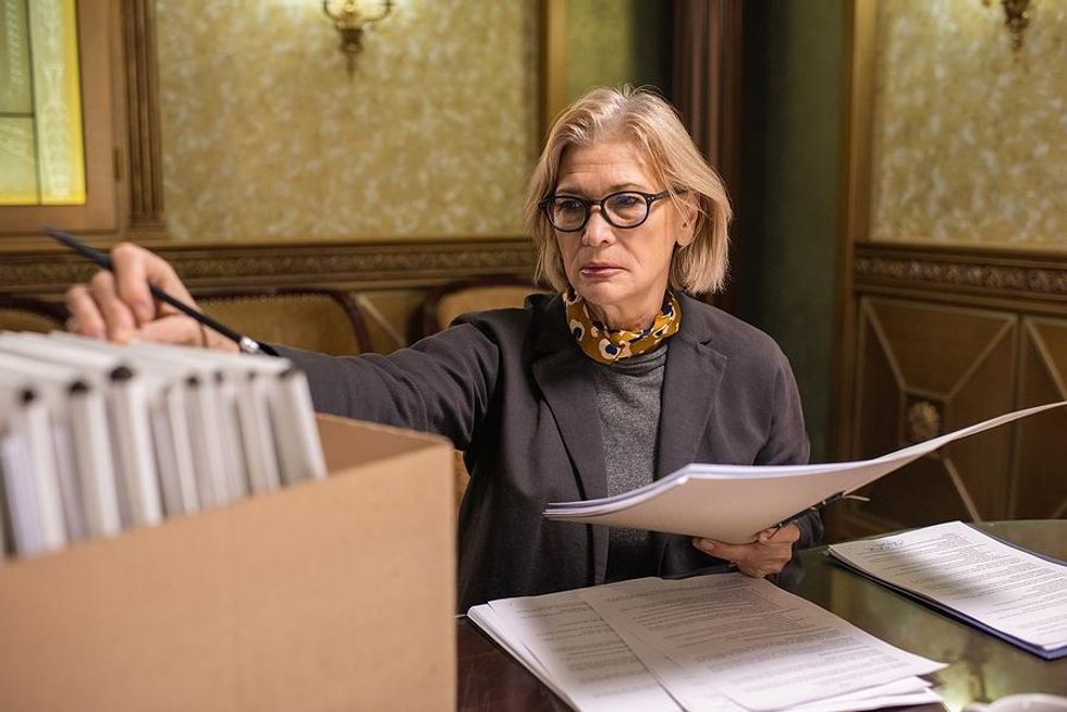 Woman organizes papers and documents