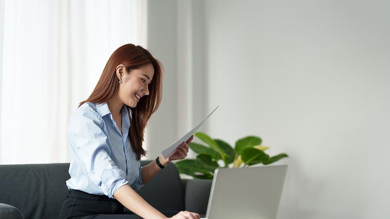 Woman reads her executive resume