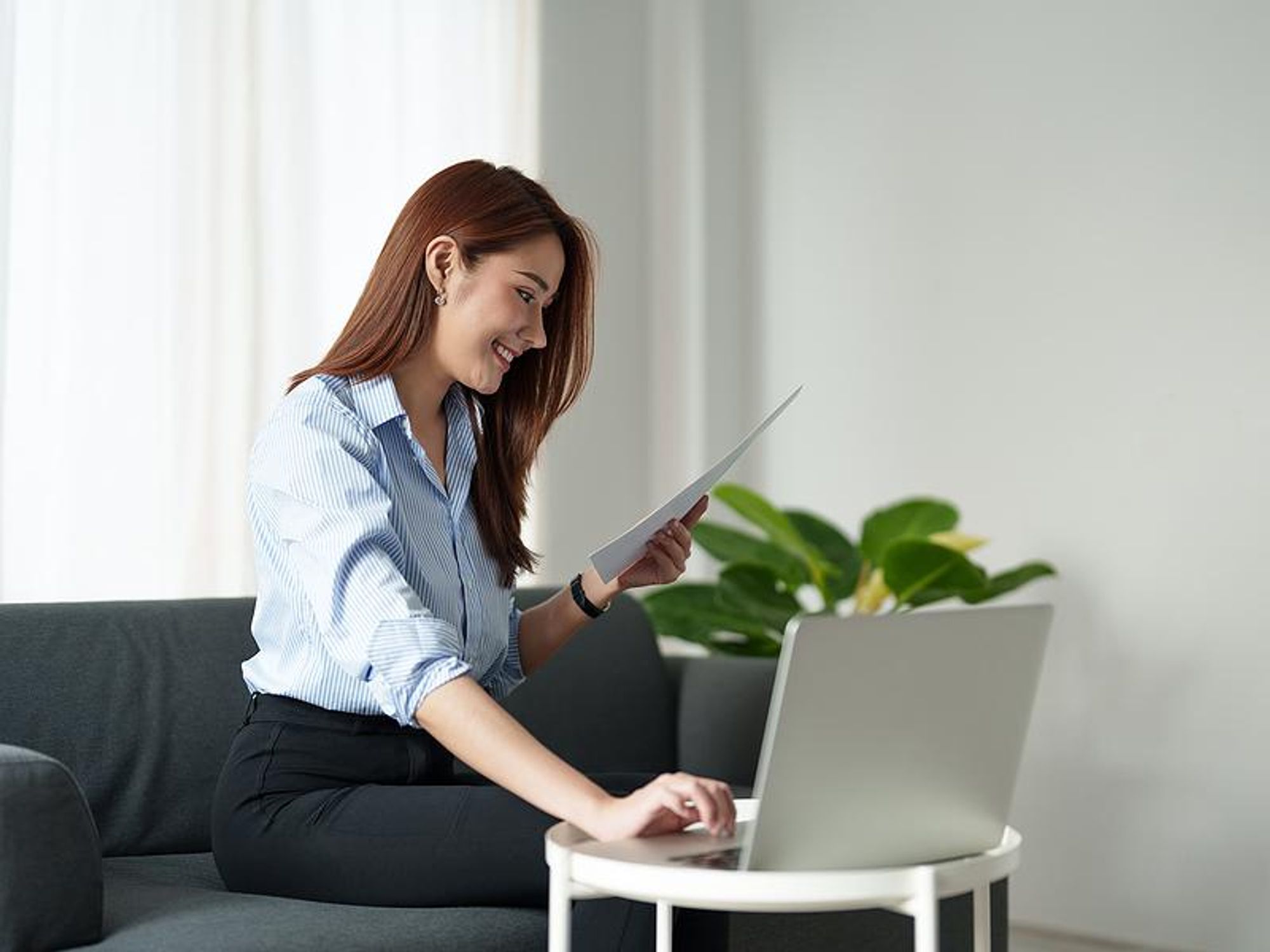 Woman reads her executive resume