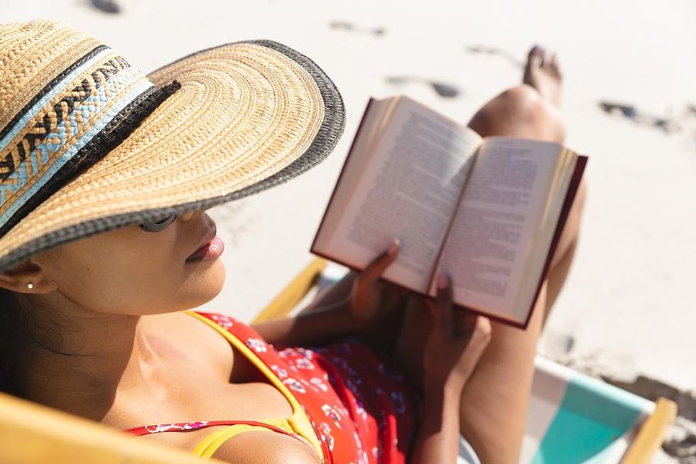 Woman reads on the beach