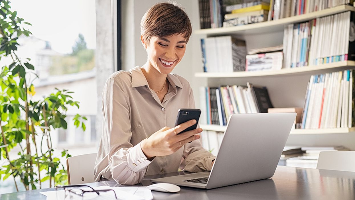 Woman receives a message on her phone from her career coach