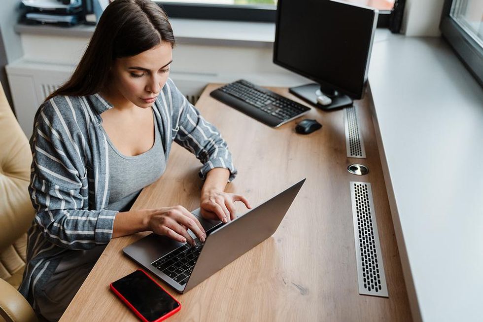 Woman removes outdated and irrelevant information from her resume