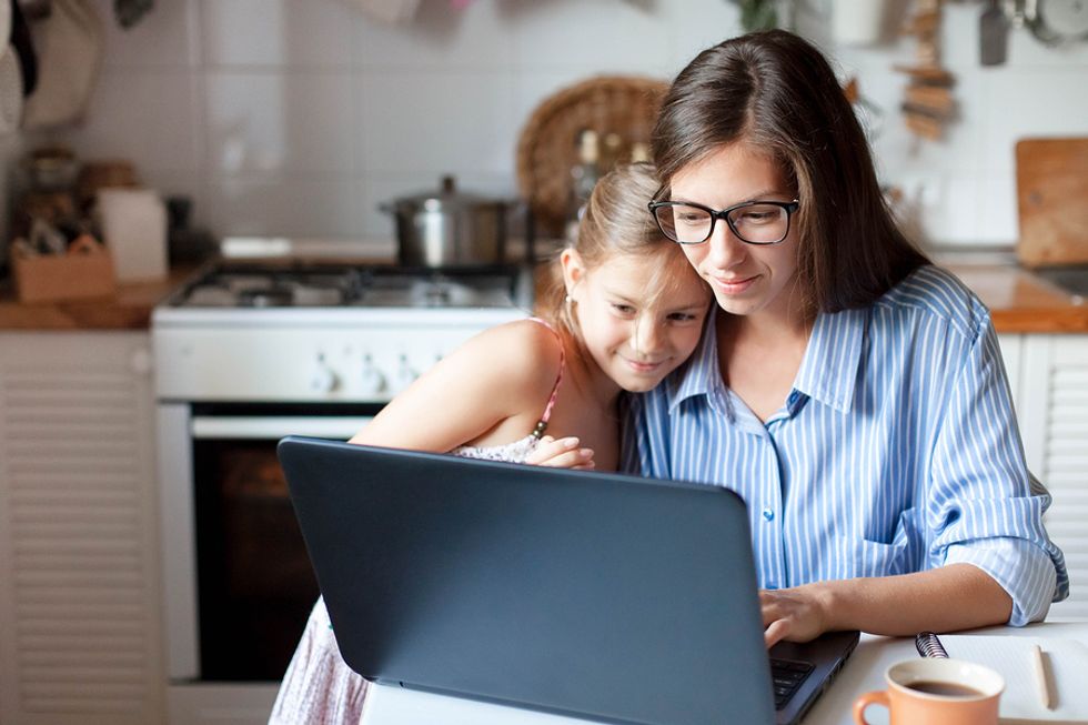 Woman researches a company before applying for a job online