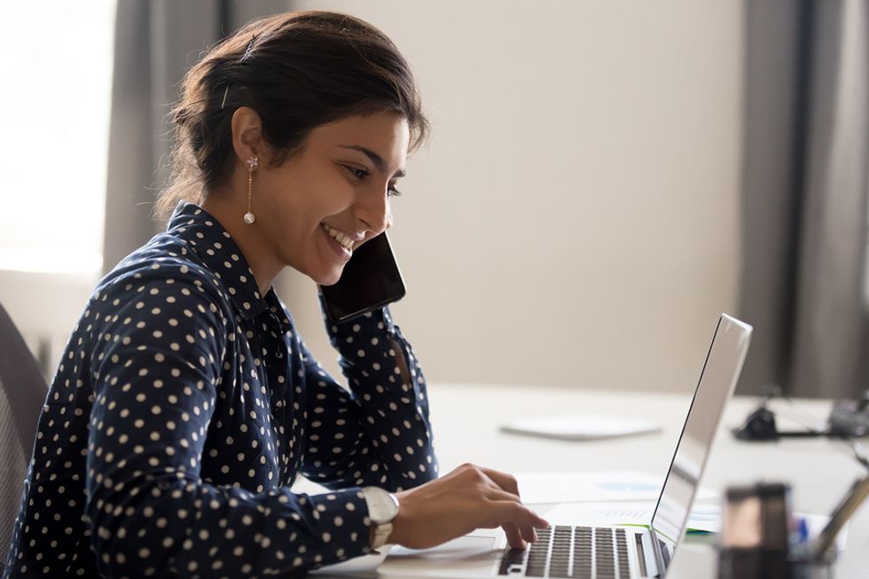 Woman researches the company before her phone interview