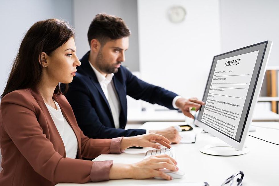 Woman reviews her employment contract