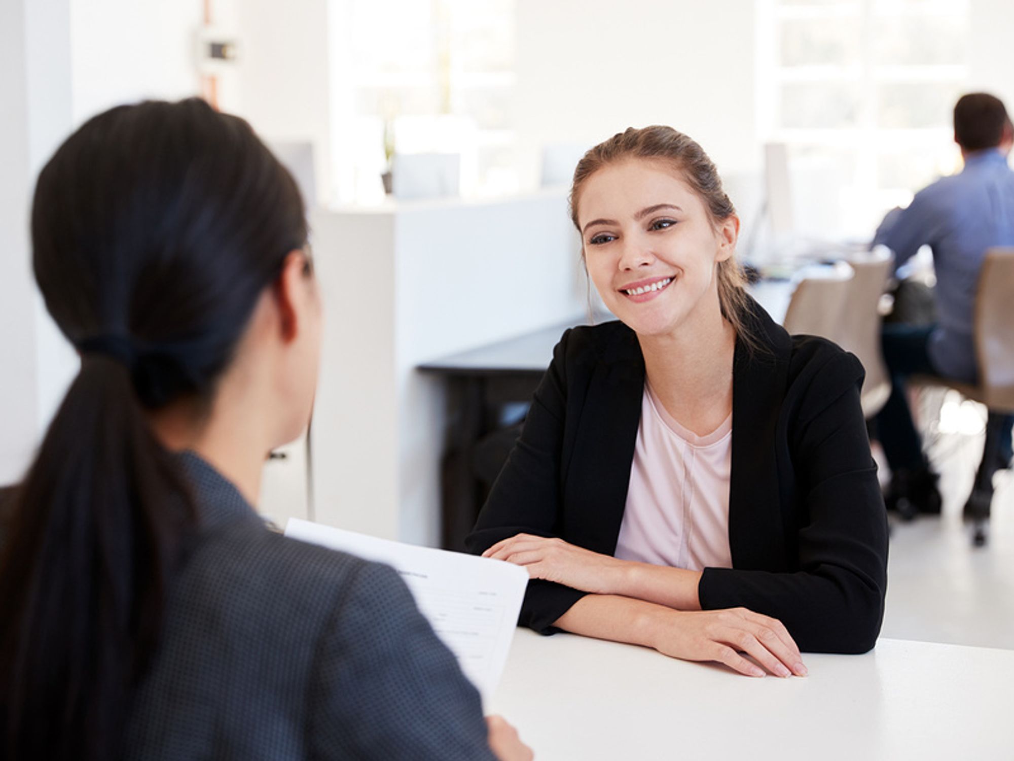 Woman smiles during a job interview