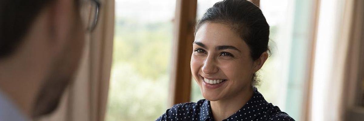 Woman smiles during a job interview