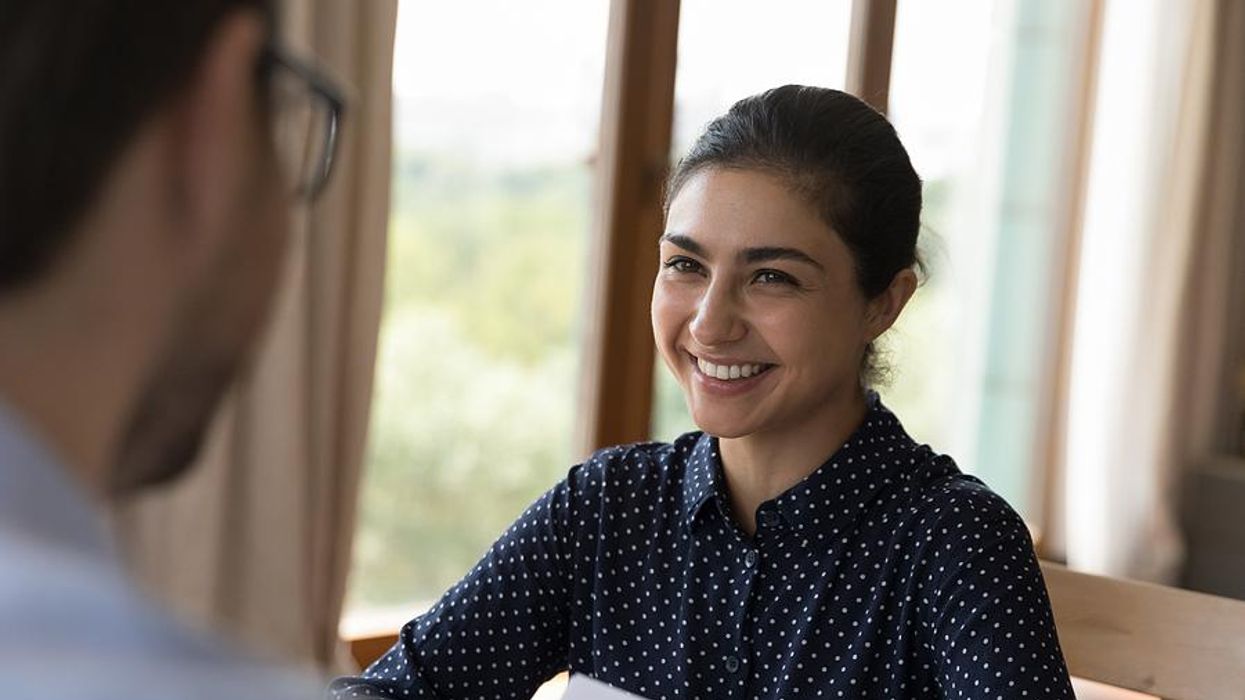 Woman smiles during a job interview