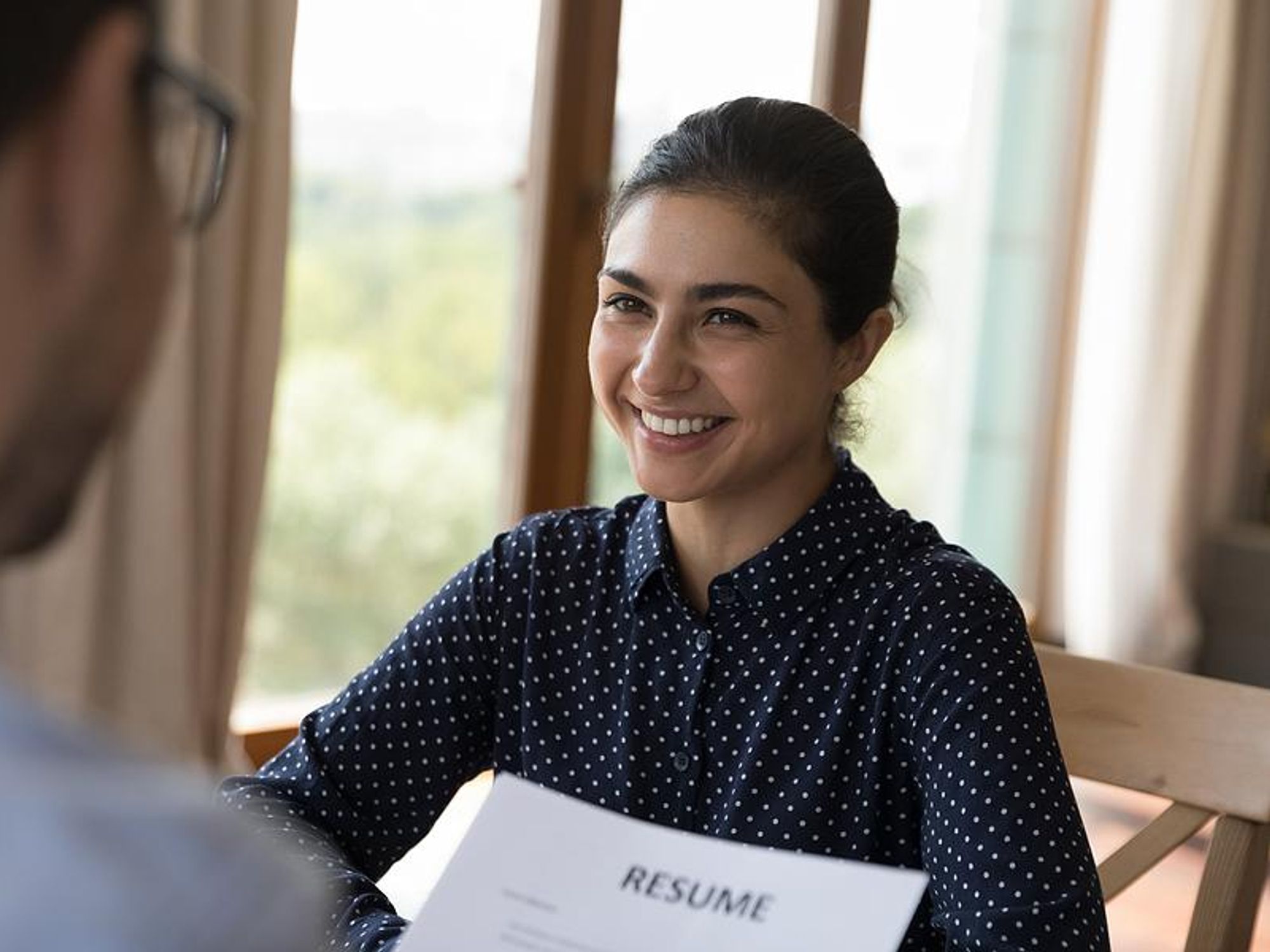 Woman smiles during a job interview