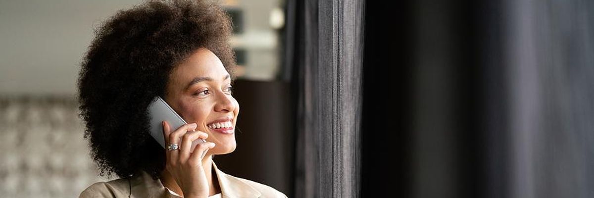 Woman smiles during a phone interview