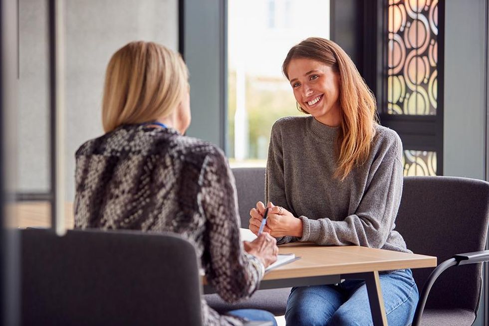 Woman smiles during an informational interview