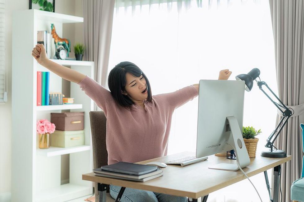 Woman stay productive while working from home in the summer