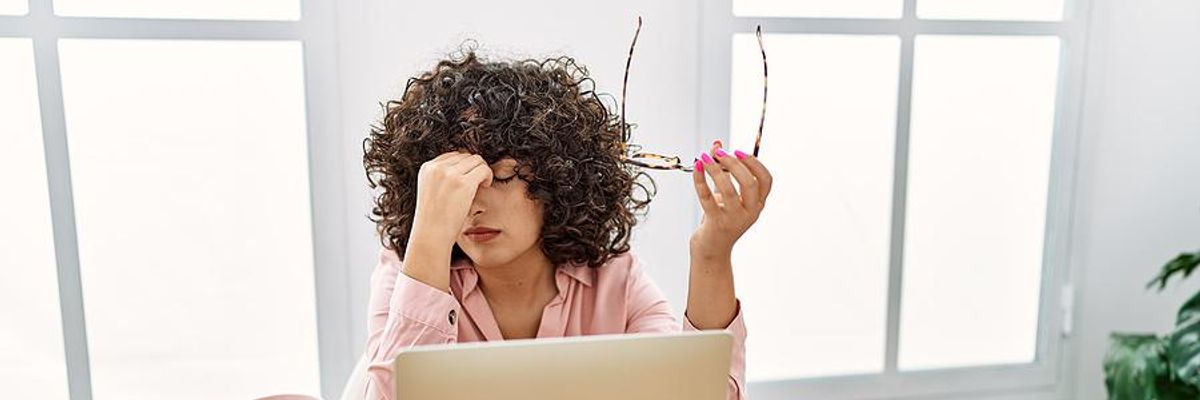 Woman stressed about an increase in her workload