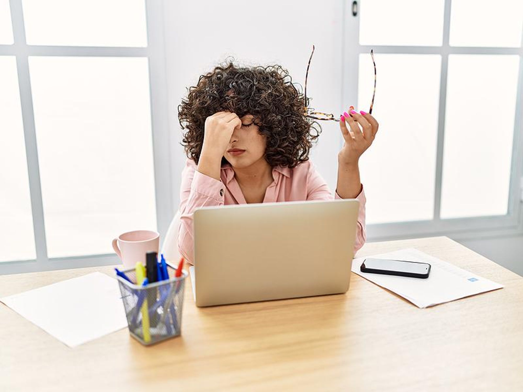 Woman stressed about an increase in her workload