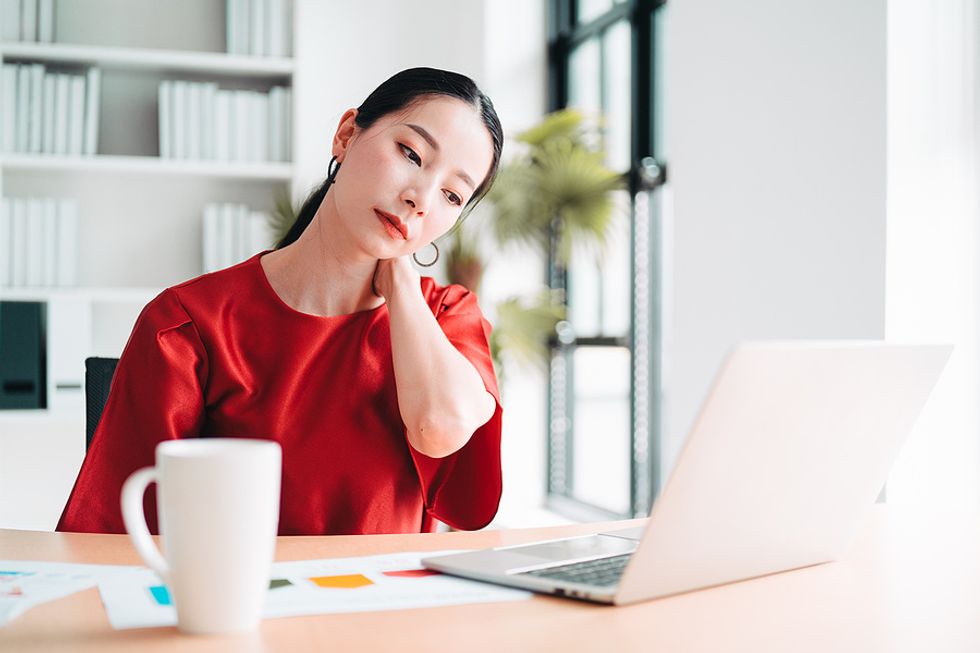 Woman stressed and burned out at work