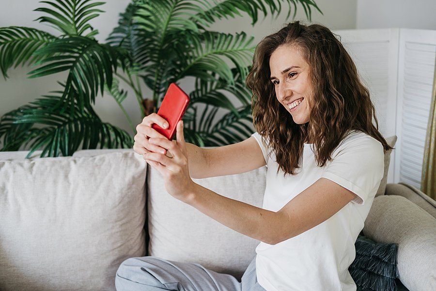 Woman takes a selfie to post on social media