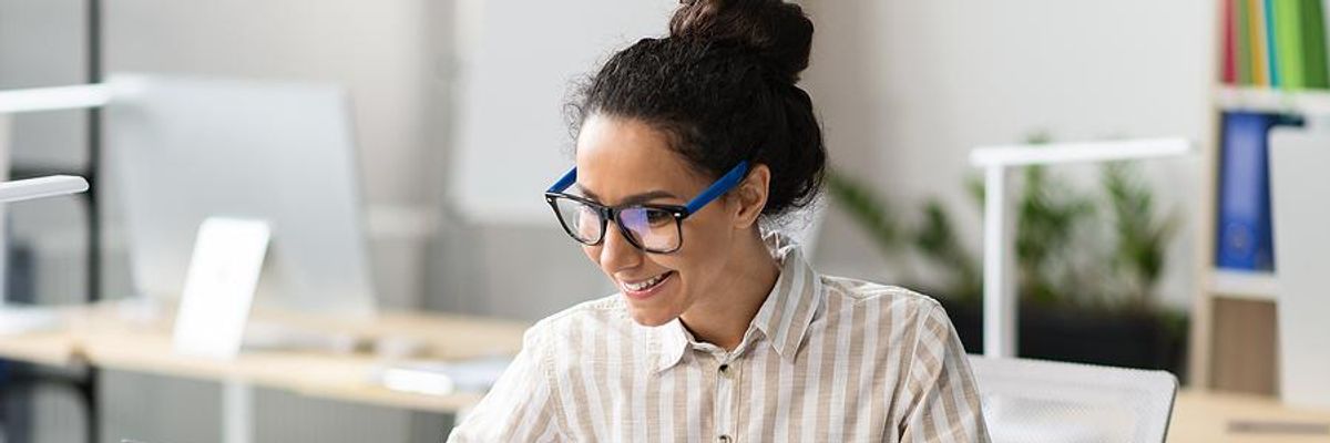 Woman takes notes at work