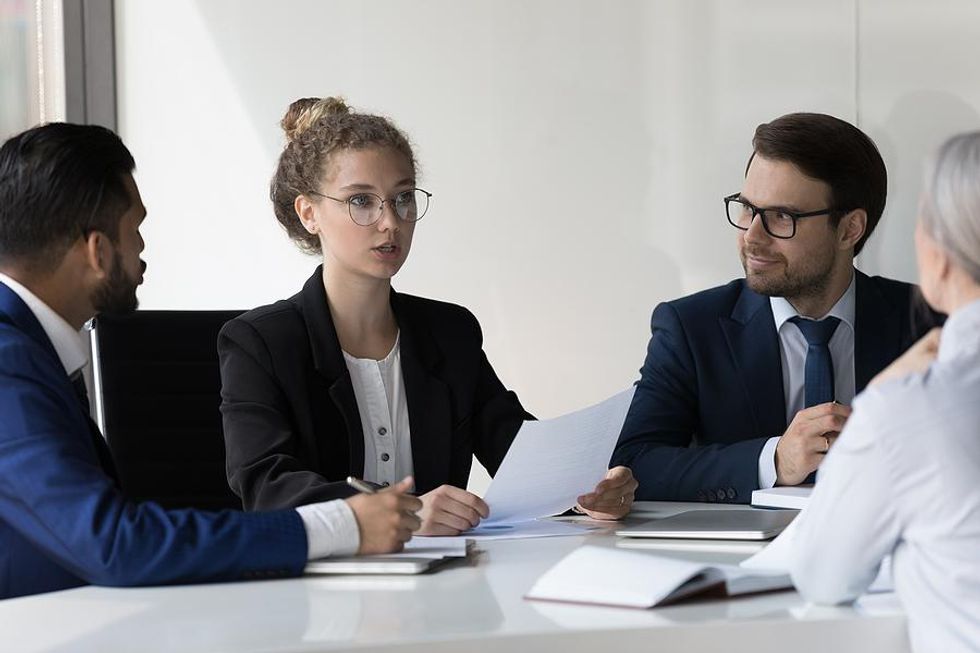 Woman talks during a meeting at work