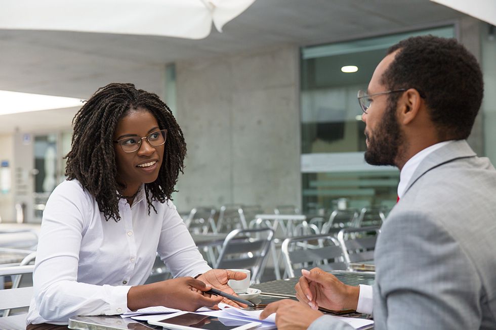 Woman talks to a career coach or a coworker