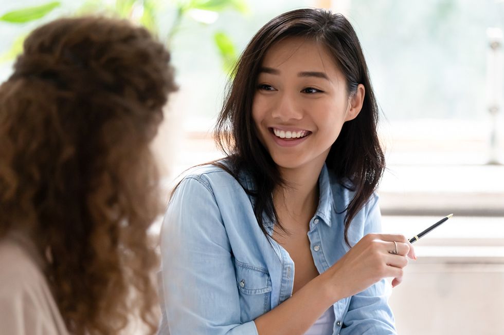 Woman talks to a colleague about community in her career