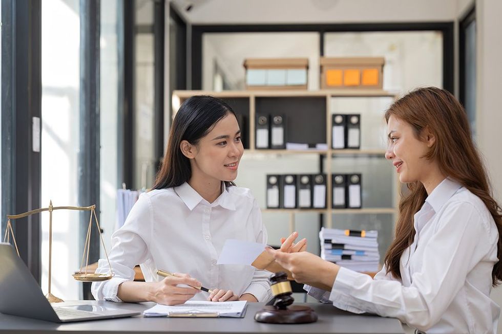 Woman talks to a customer/client during a meeting