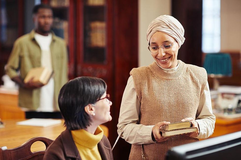 Woman talks to a librarian