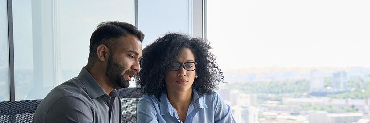 Woman talks to her boss about resetting work expectations
