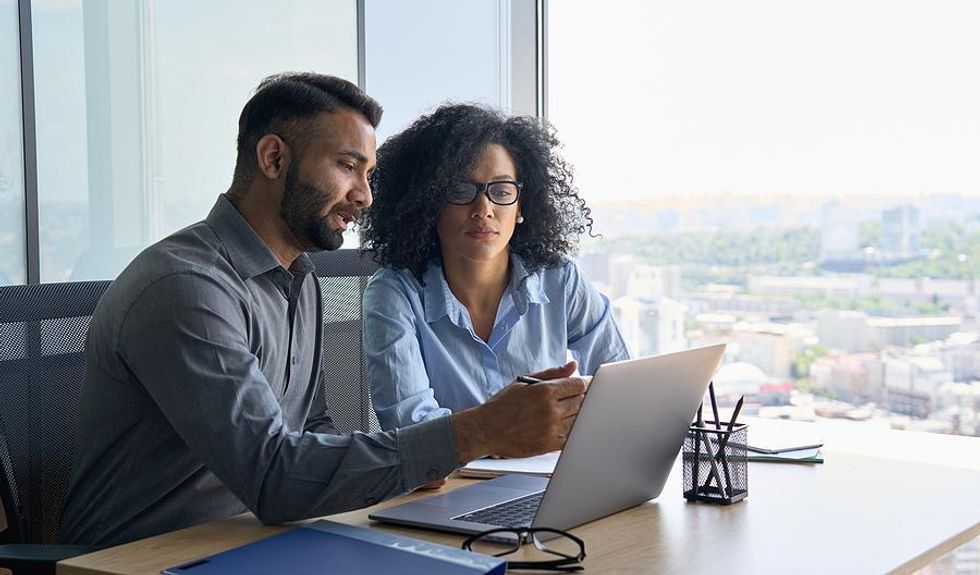 Woman talks to her boss during her performance review