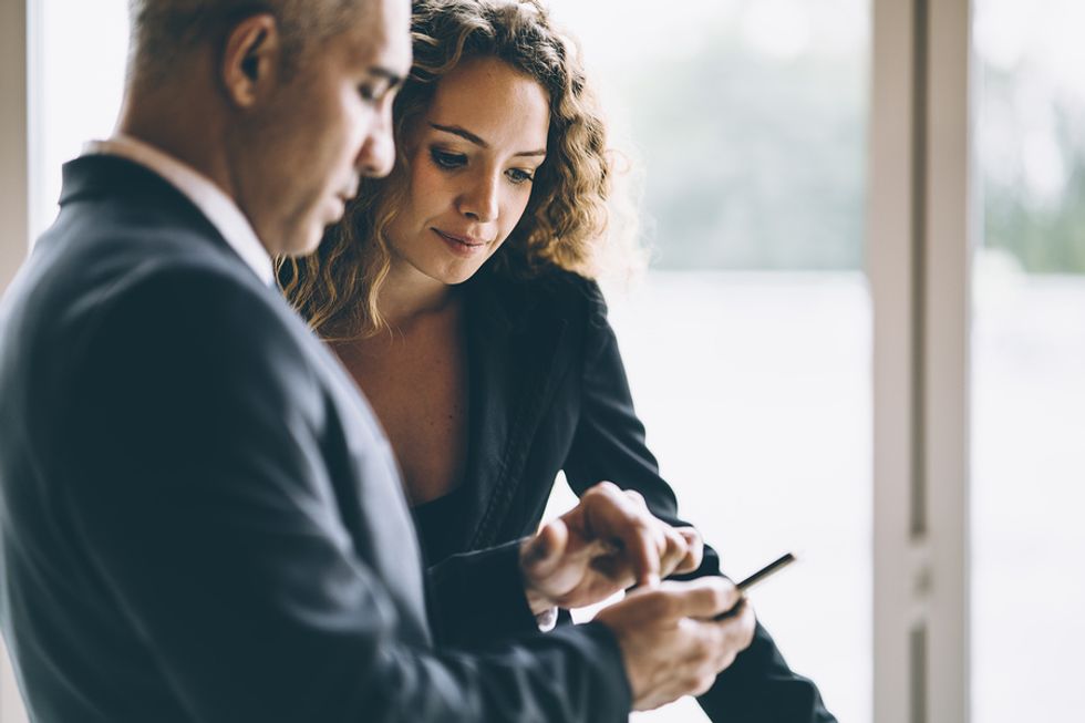 Woman talks to her boss to try to manage up