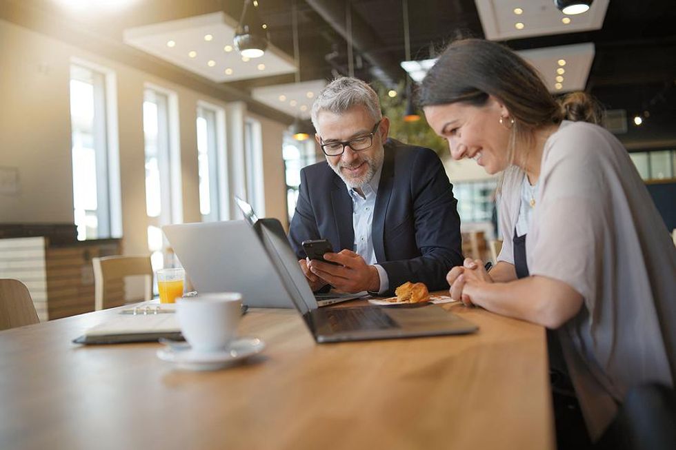 Woman talks to her mentor about work