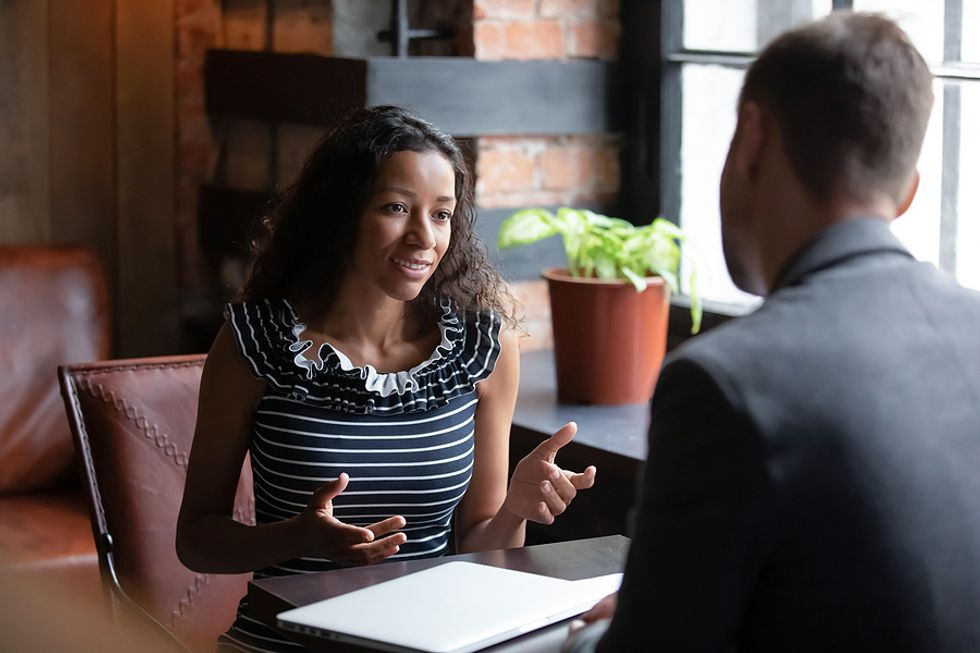 Woman talks to the hiring manager during a job interview