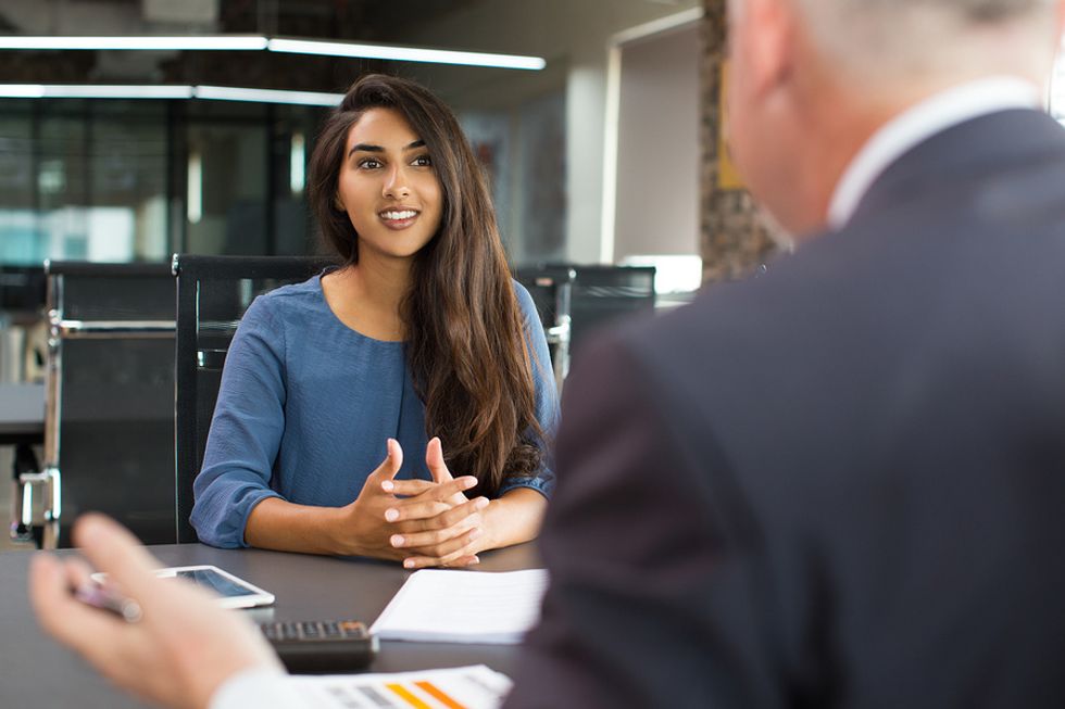 Woman thinks about the company's DE&I during a job interview